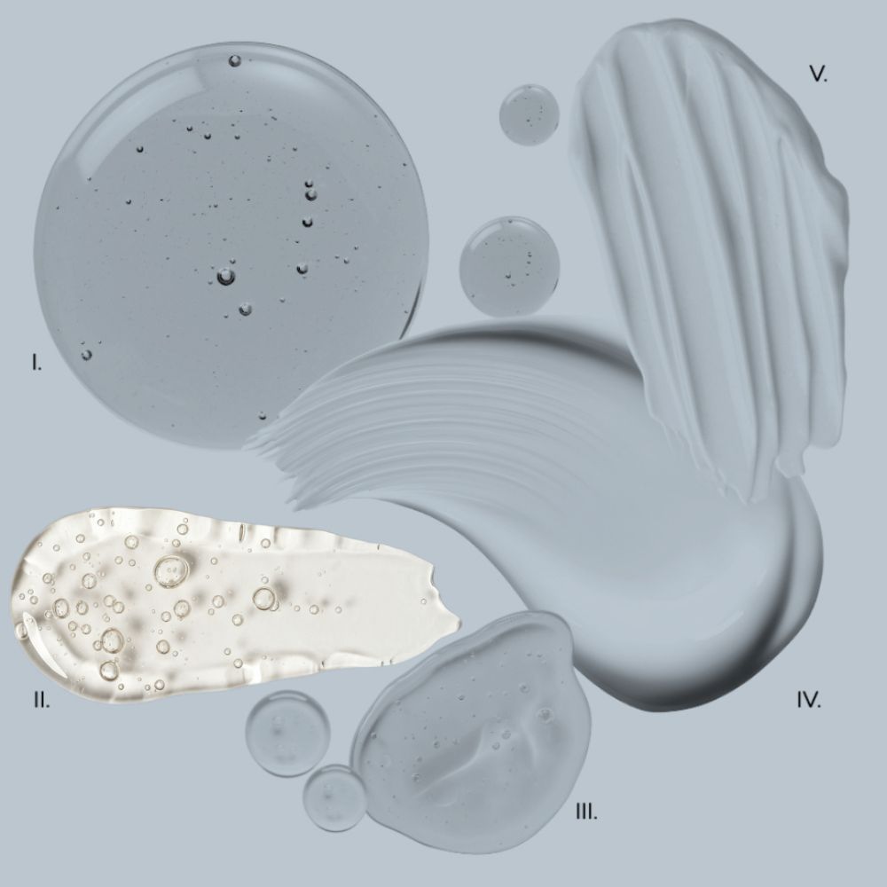 Various textures of cream or lotion on a gray background