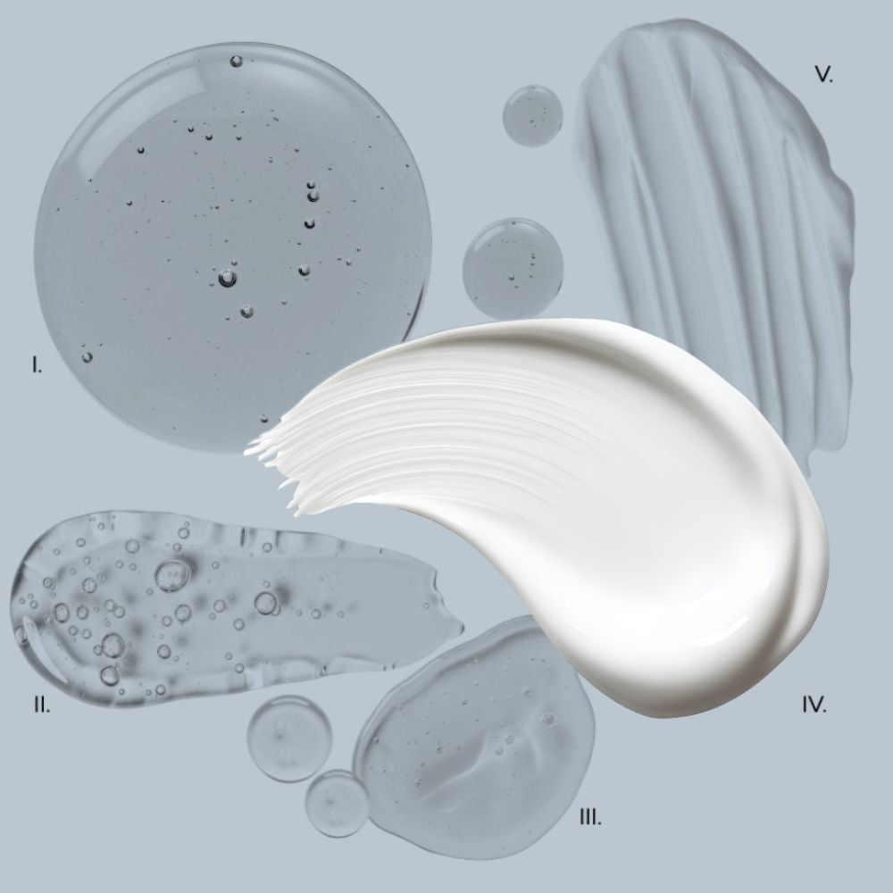 Various textures of cream and oil on a gray background