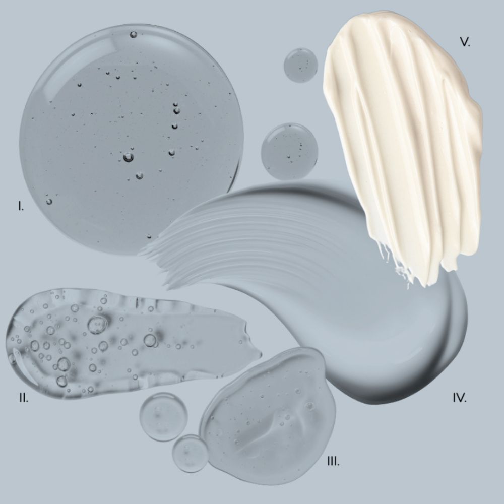 Various textures of cream or lotion on a gray background