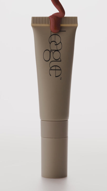 Rose plumping lip serum video to show tube and colour
