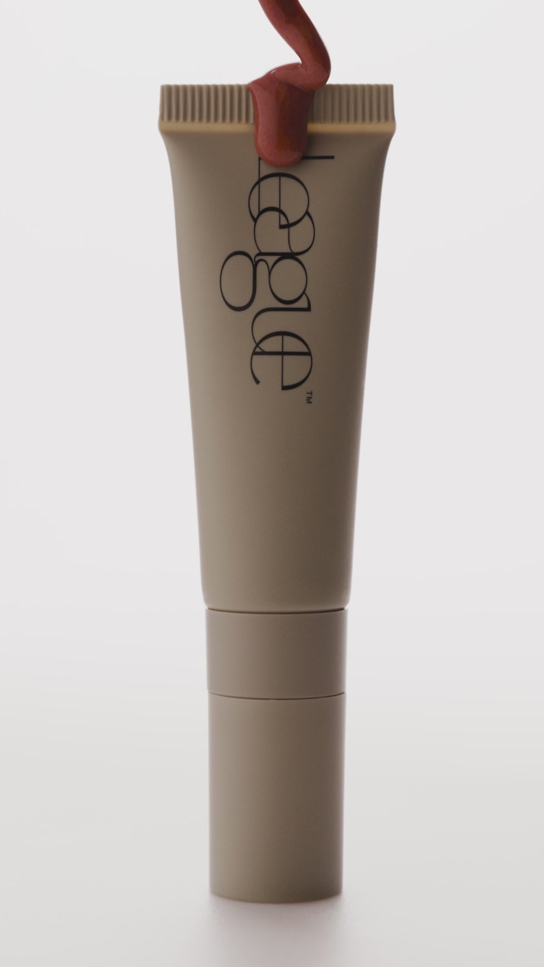 Rose plumping lip serum video to show tube and colour
